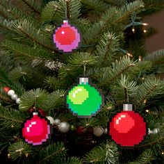 a christmas tree with pixelated ornaments hanging from it