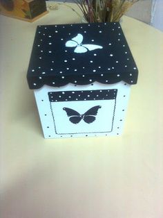 a box with a butterfly on it sitting on a table