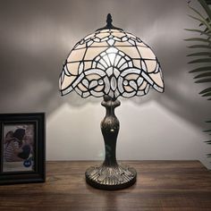 Zinc alloy base with bronze finish. Each piece of stained glass is hand-soldered into place using the traditional copper foil technique. Astoria Grand | Astoria Grand Manitou Tiffany Table Lamp White Stained Glass Baroque Style Lavender LED Bulb Included 12"W*12"D*19"H 19.0 H x 12.0 W x 12.0 D | 19" H X 12" W X 12" D | Wayfair Tiffany Style Table Lamps, Tiffany Table Lamps, Table Lamp White, Piano Room, Fixture Table, White Stain, White Table Lamp, Office Hotel, Baroque Style