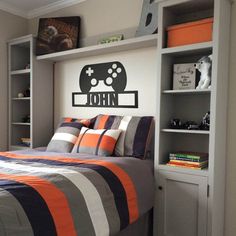 a bed room with a neatly made bed and a book shelf on the wall above it