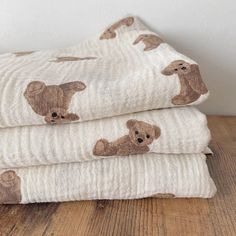 three blankets with brown teddy bears on them