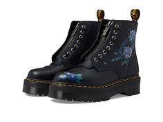 Dr. Martens Sinclair Floral - Women's Shoes : Mystic Garden Floral Print Black Backhand : Style your look in the classic beauty of the moons, stars, and wildflowers printed on the Dr. Martens Sinclair Floral booties. Full-grain Backhand leather upper adorned with antique silver star studs. Leather and textile lining with cushioned insole. Zippered side closure with laced-up front closure featuring a removable jungle front zippered piece. Ankle-length silhouette. Round toe construction. Floral pr Doc Martens Sinclair, Doc Boots, Dr Martens Sinclair, Mystic Garden, Oxford Platform Shoes, Festival Boots, Platform Chelsea Boots, Floral Boots, Leather Lace Up Boots