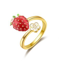 a gold ring with a strawberry on the front and a flower on the back,