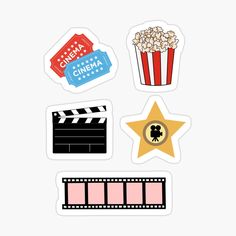 some stickers that are on top of a white surface, with films and popcorn