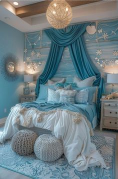 a bedroom decorated in blue and white