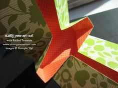 an origami box is open and sitting on the table