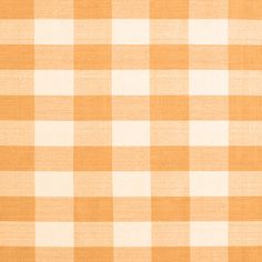 an orange and white checkered tablecloth with no pattern on it's surface