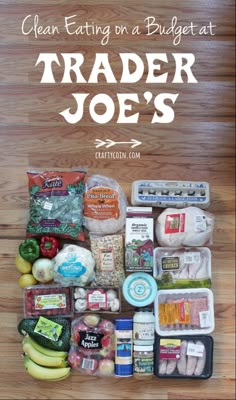 a pile of food sitting on top of a wooden table with the words clean eating on a budget at trader joe's