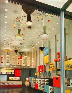 an image of a store with lots of items hanging from the ceiling and lights on the ceiling