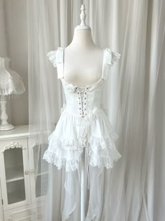 White jacquard fabric corset, under bust neckline and lace trim scallop edge hemline, lace-up closure front, decorated with white roses. Matching wih gothic or elegant classic lolita op and jsk.        	 		 			Size 			S 			M 			L 		 		 			Full Length 			75 			77 			79 		 		 			Bust 			75 			79 			83 		 		 			Waist 			61 			65 			69 		 		 			Shoulders 			34 			35 			36 Sleeveless Corset Top, White Goth, Tiered Mini Skirt, White Princess, Rosé Details, Suspender Skirt, Spaghetti Strap Dress, Sweet Lolita, White Bow