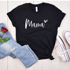 Mama shirt, Mom shirt, Mother's Day gift, Mom gift, Mother's Day shirt, Family shirt, Mom life shirt, Mommy shirt, Motherhood shirt, Mom tee, Mama tee This Mama shirt is the perfect way to show your love for your little ones. Made from high-quality materials, it features a comfortable and stylish design that's perfect for everyday wear. The shirt is available in a range of sizes and colors, making it easy to find the perfect fit for you. Whether you're out running errands or spending quality time with your family, this Mama shirt is sure to become a favorite in your wardrobe. ORDERING 1 - Select size and color 2 - Select garment type (hoodie, crewneck sweatshirt, or t-shirt) 3 - Select quantity  CARE INSTRUCTIONS Wash item inside out in cold water, do not bleach, do not dry clean, do not i Black Tops With Letter Print For Mother's Day, Mother's Day Crew Neck Cotton Shirt, Mother's Day Cotton Crew Neck Shirt, Black Crew Neck Tops For Mother's Day, Mother's Day Crew Neck Shirt With Text Print, Mother's Day Text Print Crew Neck Shirt, Crew Neck Shirt With Text Print For Mother's Day, Black Family Matching Shirt For Mother's Day, Casual Black T-shirt For Mother's Day