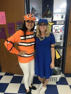 two women standing next to each other wearing costumes