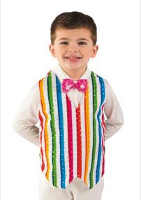 a young boy wearing a colorful vest and bow tie with his hands on his hips