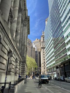 a city street lined with tall buildings and cars