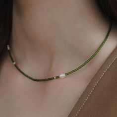 Pearl Solitaire Beaded Necklace with 925 Silver Beads,Olive Green Beaded Necklace,Minimalist Beaded Choker,Boho Jewelry,Handmade Jewelry,Gift for Her (NZ2444) ▶ Product Info. - Material: 925 Sterling Silver / Freshwater Pearl / Cubic Zirconia  - Metal Finish: Silver + Anti-Tarnish E-Coat  - Safety: Nickle & Lead free and Haypoallergenic - Length: 38cm + 5cm (length adjustable) - Weight: 3.43g - TATIANA & Silver 925 engraved tag was added. - Made In South Korea Our jewelry was plated with a high-content gold/silver layer to minimize the discoloration, compared to regular non-plating one. ▶ Shipping and Return Policies Order today to get by  Date (14days) Return & exchanges accepted within 30days Cost to ship : USD 7.00 ▶ Cancellations Cancellations : accepted Request a cancellation : before Choker Handmade, Green Beaded Necklace, Boho Choker, Handmade Gifts For Her, Necklace Minimalist, Handmade Jewelry Gift, Jewelry Cleaner, Beaded Choker, Jewelry Handmade