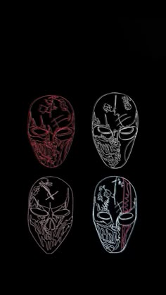 three different colored masks on a black background