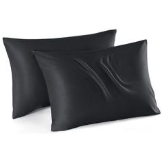 two black pillows sitting next to each other