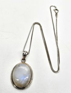 Blue Moonstone Large Flashy gemstone sterling silver pendant necklace. Good used condition with little to no signs of normal wear. Very large moonstone pendant with attached bail. Comes with sterling silver box chain. Stamped 925 on the back of the pendant. Acid tests positive for sterling silver. Necklace measures 18 inches long. Pendant measures 1 and 5/8ths of an inch tall and 1 inch wide. Blue Moonstone, Silver Box, Moonstone Pendant, Long Pendant, Sterling Silver Necklace Pendants, Silver Pendant Necklace, Box Chain, Sterling Silver Pendant, Sterling Silver Pendants