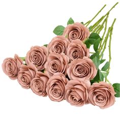 a bunch of pink roses with green leaves