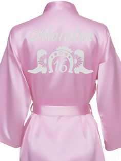 Elevate your Sweet 16 celebration with our exquisite Pink and Silver Robe, designed to make you feel like the star of the show! This stunning robe features a soft pink hue beautifully complemented by elegant silver accents, perfect for any glamorous occasion. Each robe is fully personalized, adding a unique touch that showcases your individuality. Whether for getting ready or as a stylish accessory during the festivities, this robe is a must-have for your special day! Includes : RobeAll the item Elegant Pink Bridesmaid Robe, Pink Fitted Robe For Wedding Night, Pink Satin Party Robe, Pink Long Sleeve Wedding Robe, Pink Long Sleeve Satin Robe, Elegant Pink Wedding Robe, Pink Fitted Long Sleeve Robe, Fitted Long Sleeve Pink Robe, Silver Accents