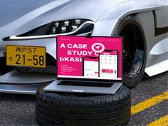 a laptop computer sitting on top of a car tire