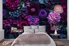 a bedroom with purple flowers on the wall