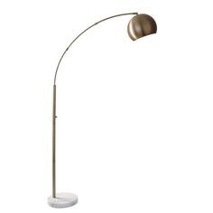 a floor lamp with a white base and a gold colored light on the top of it