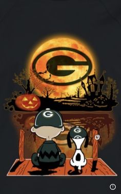 a green bay packers shirt with a cartoon character sitting in front of an orange pumpkin