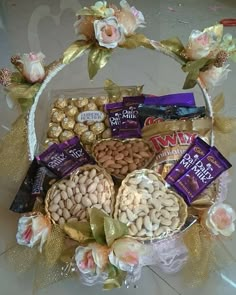 a basket filled with assorted chocolates and nuts