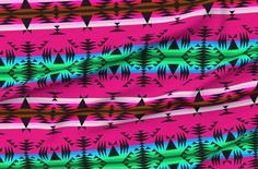 an image of a pink and blue pattern with trees in the background on a blanket