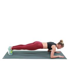 a woman is doing push ups on her stomach