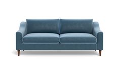 a blue couch sitting on top of a white floor