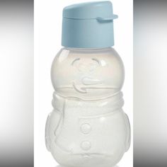 a baby bottle with a snowman design on the side and a blue lid is shown