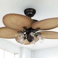 a ceiling fan with five light bulbs hanging from it