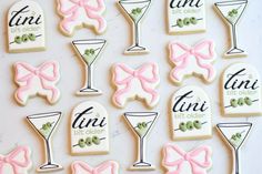 decorated cookies with pink bows and cocktail glasses