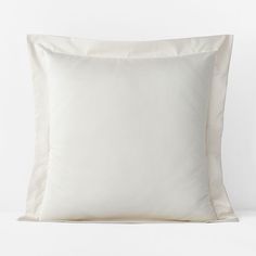 a white pillow with two pillows on it