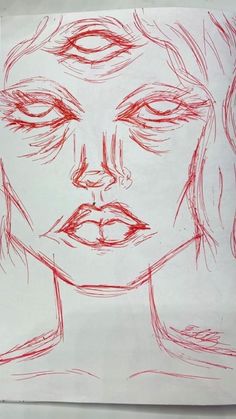 a drawing of a woman's face is shown in red ink on white paper