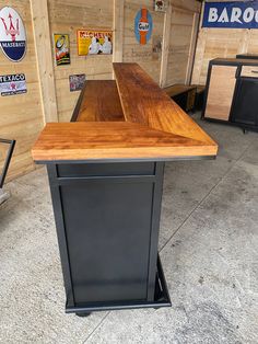 a wooden counter top sitting inside of a building