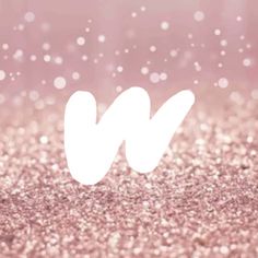 the letter w is made up of white letters on a pink and gold glitter background