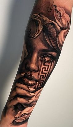 a woman's arm with tattoos on it and an image of a snake in the background