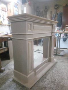 an unfinished fireplace in the middle of a room