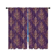 purple curtains with gold designs on them