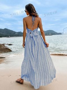 Color : BlueStyle : BohoDetails : Backless, Split ThighType : CamiPattern Type : Plain, StripedSleeve Length : SleevelessNeckline : HalterWaist Line : High WaistHem Shaped : SlitLength : LongFit Type : Slim FitFabric : Non-StretchMaterial : FabricComposition : 100% PolyesterCare Instructions : Machine wash, do not dry cleanSheer : No Size US Bust Length Straps Length Waist Size S 4 36.2 48.8 32.3 26.8-41.7 M 6 37.8 49.2 32.5 28.3-43.3 L 8/10 40.2 49.6 32.8 30.7-45.7 XL 12 42.5 50 33.1 33.1-48 Blue Halter Neck Dress For Beach Cover-up, Blue Spaghetti Strap Dress For Beach Season, Blue Halter Neck Summer Sundress, Blue Summer Halter Dress For Vacation, Blue Sundress For Spring, Beach Cover-up, Light Blue Summer Sundress For Party, Blue Sundress For Spring Beach Cover-up, Blue Backless Sundress, Beachy Blue V-neck Sundress