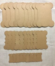 six pieces of brown paper with stitching on them