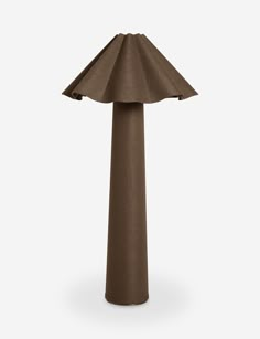 a tall brown lamp on a white background