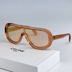 New Celine Cl40021i 42x Orange Blue Mirror Shield Women Sunglasses Cl 40021i Brand: Celine Model Number: Cl40021i / Cl 40021i Color Code: 42x Gender: Women Frame Shape: Shield Frame Color: Shiny Orange Frame Material: Acetate Frame Type: Full Rim Lens Color: Blue Mirror Lens Material: Organic Plastic Size: 00x00x145 100% Uv Protection! Brand New And 100% Authentic! Made In Italy. Full Retail Celine Package: 1. Glasses 2. Flat Branded Case 3. Cleaning Cloth With Brand Logo 4. Manufacturer's Infor Luxury Retro Clear Sunglasses, Designer Gold Sunglasses With Glass Lenses, Product Booklet, Luxury Gold Sunglasses With Glass Lenses, Celine Gold Sunglasses, Luxury Orange Sunglasses, Glasses Fashion Women, Celine Model