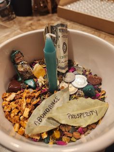 With simple ingredients and an easy set up, this Money Bowl Kit is the perfect addition to your altar or living space. *Please note: this kit does not come with the bowl or coins/dollar bills. Store bought dried bay leaves work best to write your intentions onto when you need to change out the included bay leaves (Prosperity, Abundance, Bills Paid, Larger Paychecks, Free Gifts...etc) and a gold or green bowl works best, but it doesn't matter the size. Fit it to your available space.* **Place the rice at the bottom of the bowl, slide the green candle in, then sprinkle the herb mixture and gemstones around it, placing the Goldstone, Malachite & orange peel pieces wherever feels right to you. BEFORE USE: recite the included prosperity spell, and light the candle. Blow it out and relight it as Witchcraft Money Bowl, Money Bowl Witchcraft, Prosperity Altar, Money Witchcraft, Money Bowl Spell, Abundance Altar, Spell Bowl, Money Oil Recipe, Money Altar