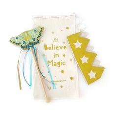 a bag with some items on it and the words believe in magic next to it