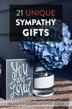 blue hydrant in a vase with the words unique sympathy gifts on it next to a card