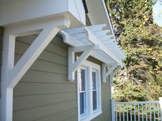 the corner of a house with white trim